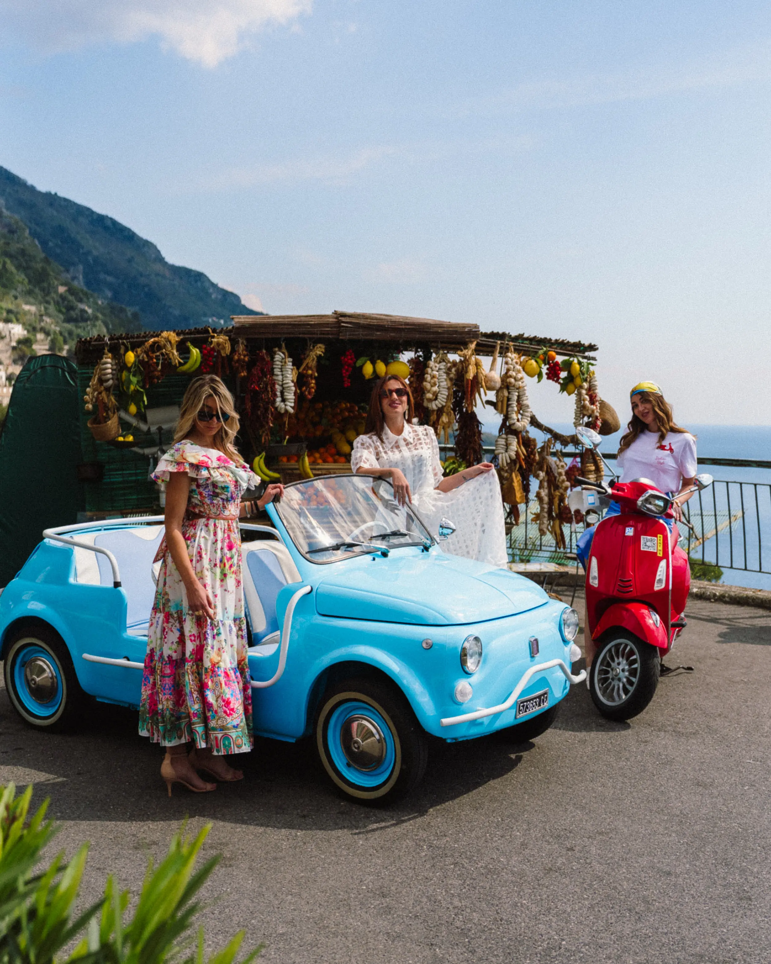 Group photo in the open-top Fiat 500 Jolly with Amalfi Coast backdrop