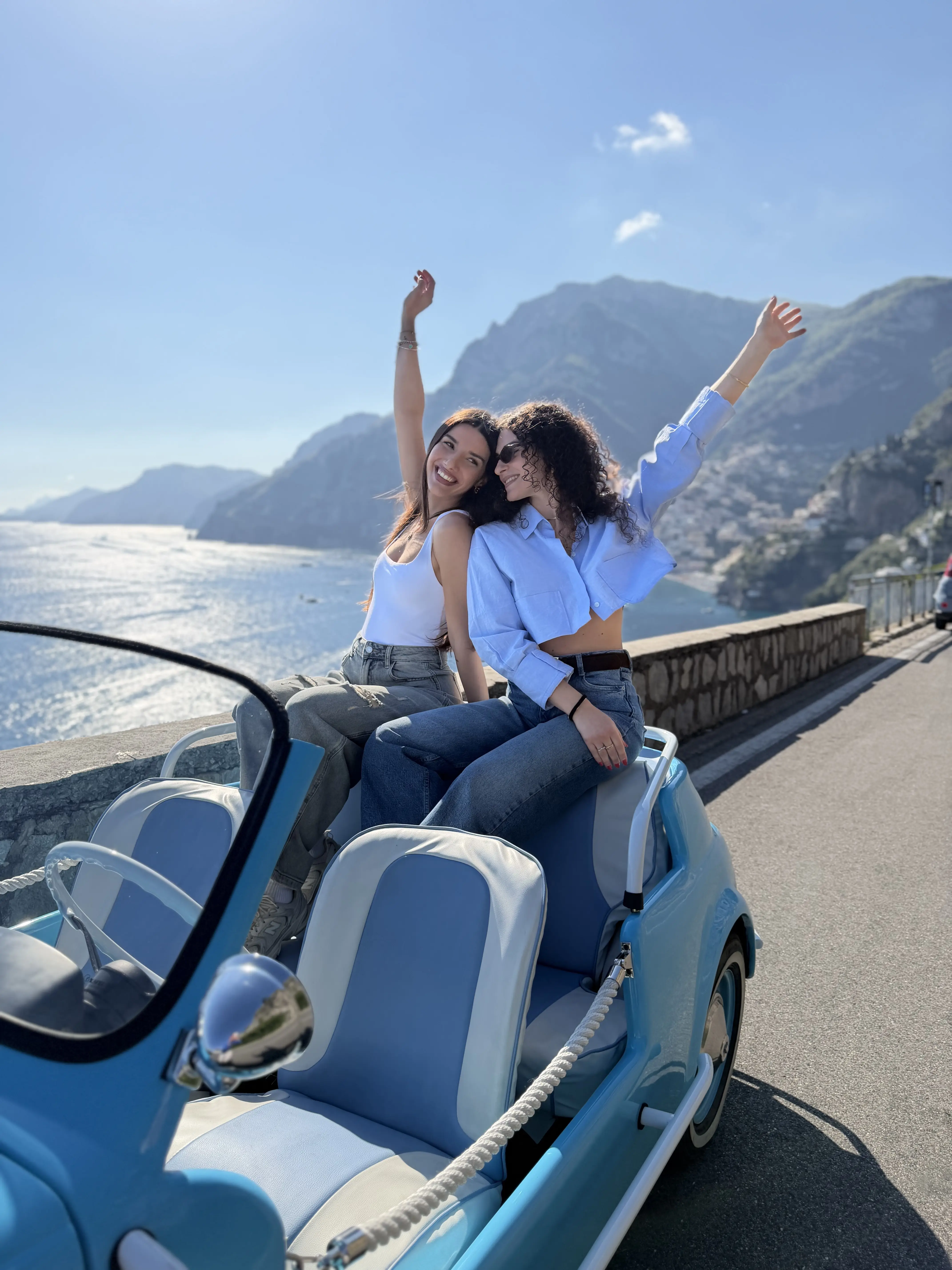Group photo in the open-top Fiat 500 Jolly with Amalfi Coast backdrop